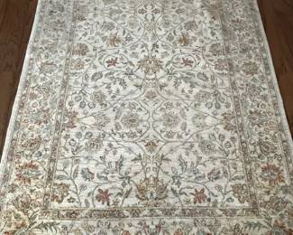 $120 cream rug with small orange flowers 4’ x 6 ‘