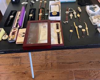 Assorted jewelry and Disney watches