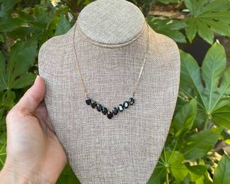 $220 - 10kt necklace black stones (9) total weight 10.27