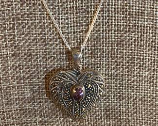 $30 - Sterling heart with amethyst center on chain