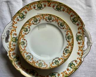 Intricate multicolored festive ceramic dish set with gold detail 