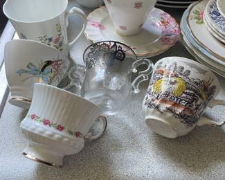 Assorted ceramic cups in kitchen 
