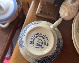 Bottom side of white and blue patterned ceramic cup 