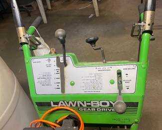 Second angle of vintage lawn clipper in basement 