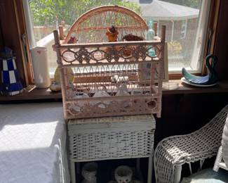 Wicker shelf and assorted knick knacks in sunroom 
