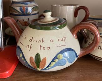 Tea pot with unique decorative design and quirky typography 