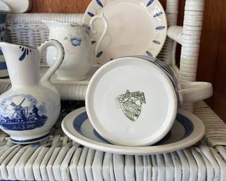 Bottom side of white and blue decorative dish in sunroom 