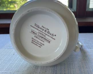 Bottom side of large white, blue floral spouted jug 