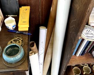 Rolled up vintage maps in sunroom 