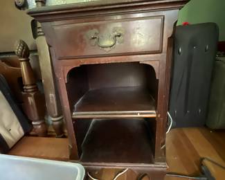 Wooden side table with brass detail in second office