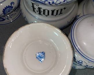 Bottom side of decorative white and blue ceramic kitchen set 