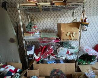 Shelf of assorted Christmas decorations in upstairs bedroom 