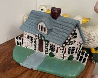 Quaint cottage doorstopper 