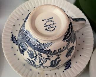 Bottom side of blue and white ceramic cup and set of saucers 