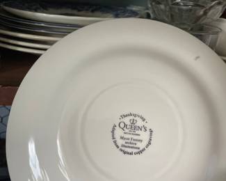 Bottom side of white and blue Thanksgiving themed ceramic dish 