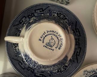 Bottom side of blue and white ceramic cup and set of saucers 