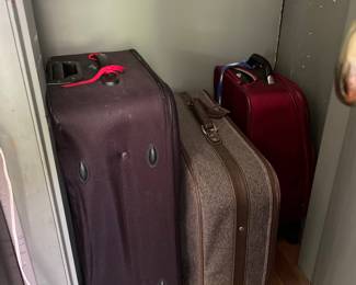 Luggage in closet of second office 