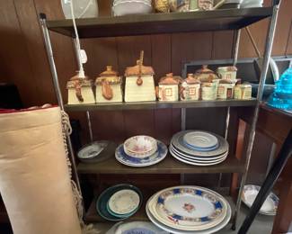 Entire shelf of ceramic plates, decor in den 