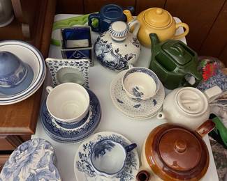 Assorted ceramic dishes in den 
