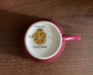Bottom side of red and gold floral decorative tea set (England Empire)