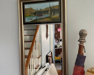 Gold framed, painted mirror in front hallway 