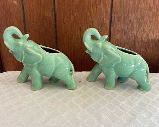 Two teal ceramic elephant tea candle holders 