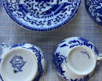 Bottom side of white/blue floral ceramic cups 