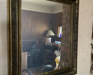 Decorative framed mirror in den 