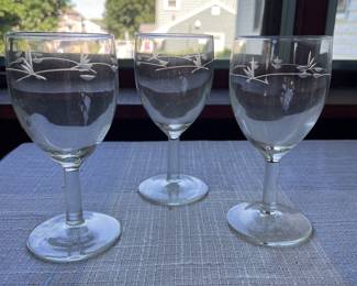 Three engraved wine glasses 