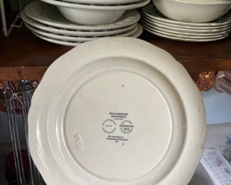 Bottom side of white, multicolored floral decorative ceramic plate 