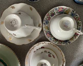 Bottom side of assorted ceramic floral designed teacup and matching saucer 