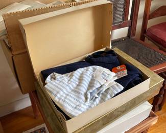 Pile of vintage baby clothes in upstairs bedroom 