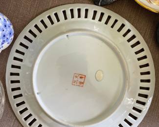 Backside of Intricate, multicolored, painted plate 