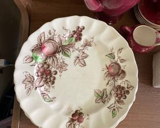 White scalloped autumnal themed plate in office 