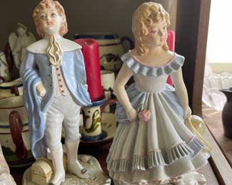 English man and woman ceramic statues