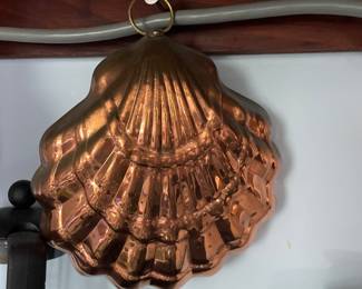 Unique sea-shell shaped, textured brass dish in kitchen 