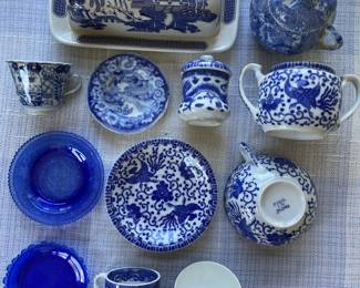 Assorted white and blue ceramic/glass plates, cups, butter dish, various countries of origin