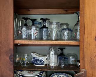 One kitchen cabinet of ceramic/glass dishware 