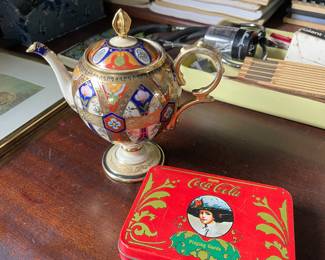 Gold, multicolored ceramic vase and vintage tin 