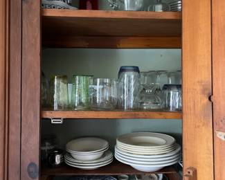 One kitchen cabinet of ceramic/glass dishware 