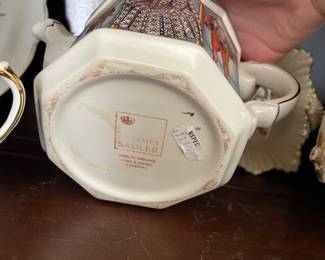Bottom side of Queen Victoria ceramic tea pot with gold detail 