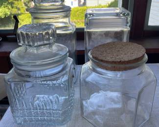 Four large glass containers