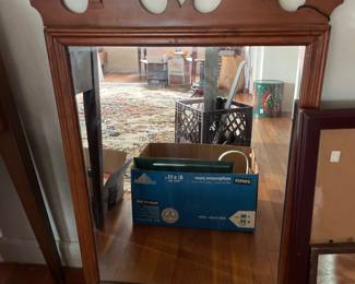 Decorative wooden mirror in upstairs bedroom
