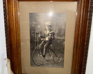 AMAZING PHOTO OF CHILD ON TRI-CYCLE IN FRAME 
