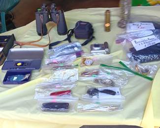 Bausch & Lomb Binoculars, Canon camera, jackknives, watches, pocket watch, Cross pen, electric razor, blood pressure kit