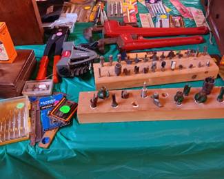 Bits, new Allen wrenches, rivet, pipe wrenches, saw blades.