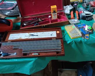 Civil War pistol kit. LeRoy Lettering Set, boxed antique drill bits, table top bench.