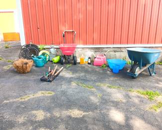 Gardening tools, hoses, wheelbarrow, tiki torches, seeder.