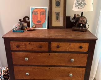 Antique five-drawer dresser with (newer) ornate pulls.