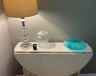 Painted (chabby chic) drop-leaf table; nice selection of lighting and glassware throughout the house, including the cookie jar and platter shown here.